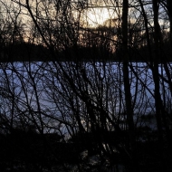 Odraz slunce na zamrzlém Kačerovském rybníce
